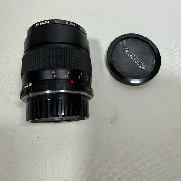 Yashica Zoom Lens 42- 75mm with case & Hakuba uv 55mm lens